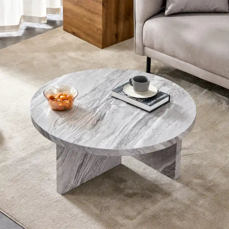 Une table basse à motifs circulaires en MDF blanc, adaptée aux petits espaces et aux salons.