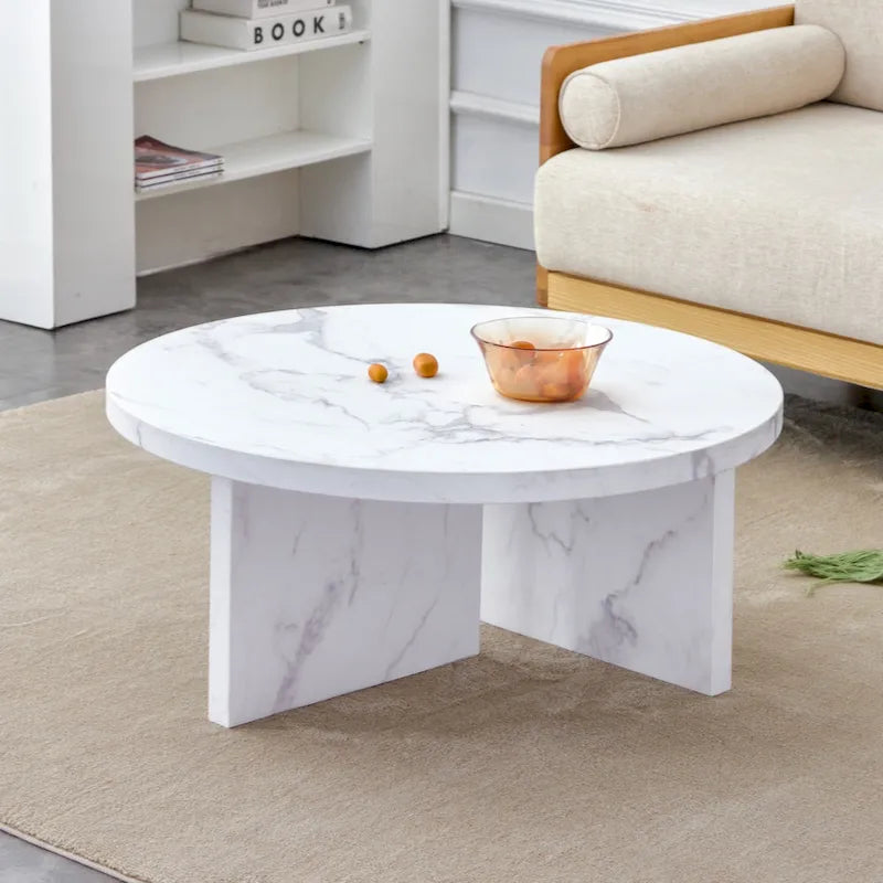 Une table basse à motifs circulaires en MDF blanc, adaptée aux petits espaces et aux salons.